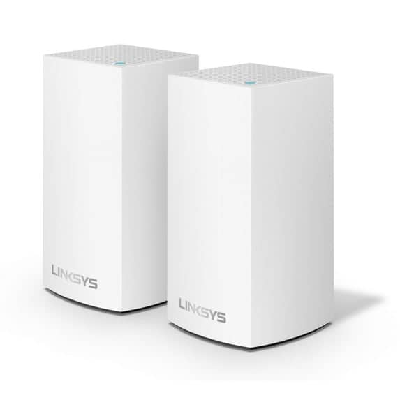 Linksys Velop AC2400 mesh router nodes placed in a modern living room